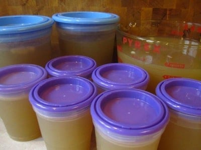 Chicken stock portioned into storage containers