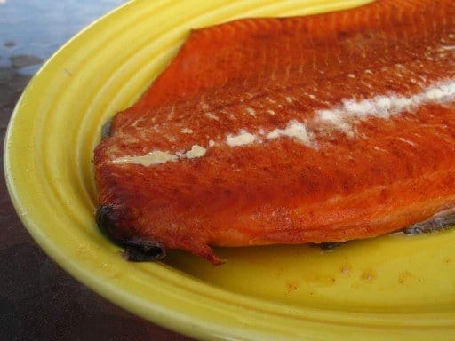 Grill smoked salmon on a yellow platter