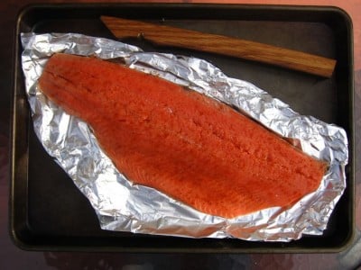 Side of salmon on a piece of aluminum foil