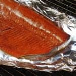 Side of grill smoked salmon on a sheet of foil