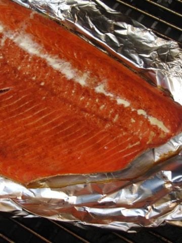 Side of grill smoked salmon on a sheet of foil