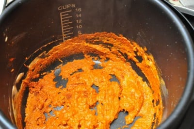 Frying the curry paste with the cream