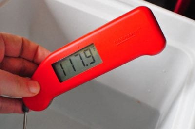 Thermometer reading of 117.9°F in the beer cooler