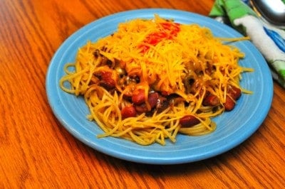 A plate of five way - spaghetti, chili, beans, onions and cheese