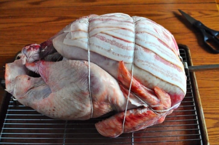 Bacon trussed to the turkey