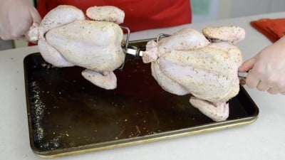 Seasoned, trussed, and spit