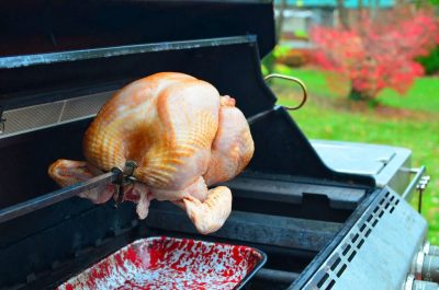 Turkey on the spit, spit on the grill, drip pan underneath