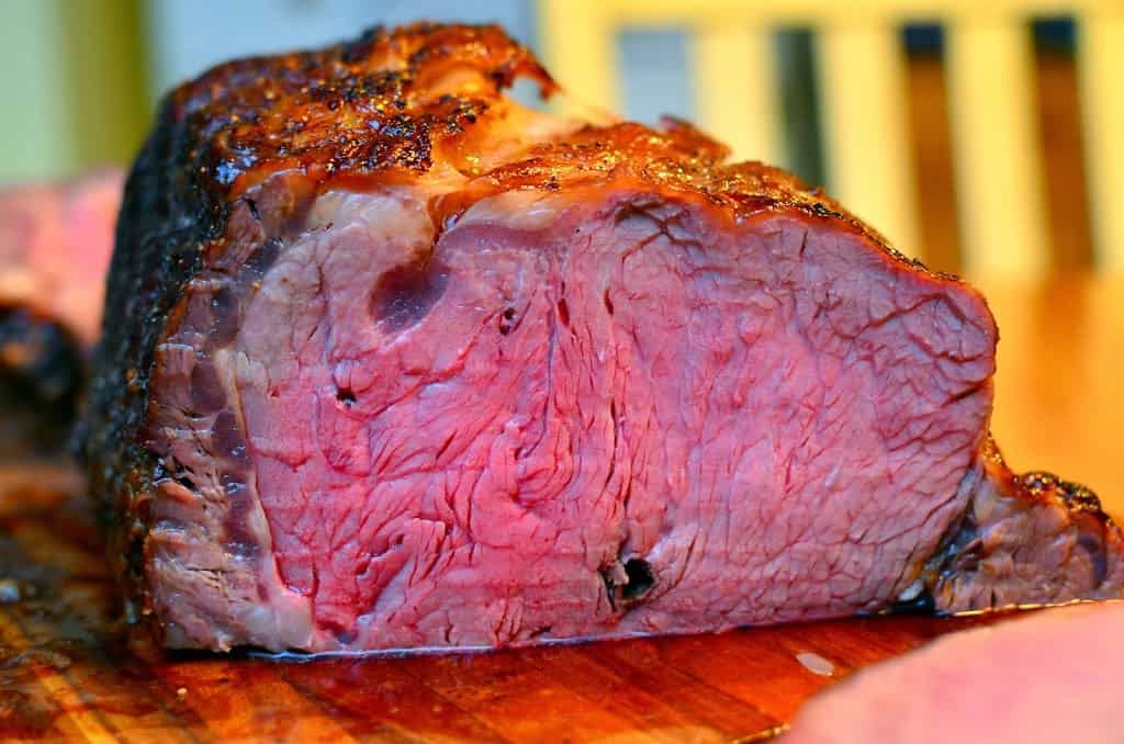 Prime rib roast, sliced to show the pink interior