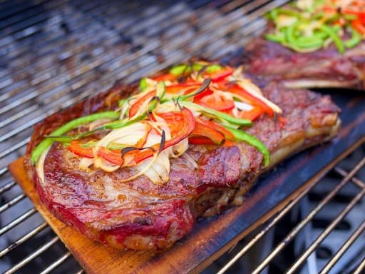 Cedar Plank Grilled Ribeye with Peppers and Onions | DadCooksDinner.com