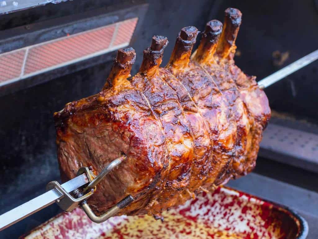 A prime rib roast cooked on the rotisserie