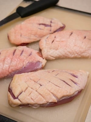 Scoring the duck breasts