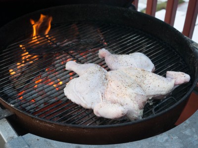 Chicken over indirect heat - away from the coals, legs pointing towards the heat