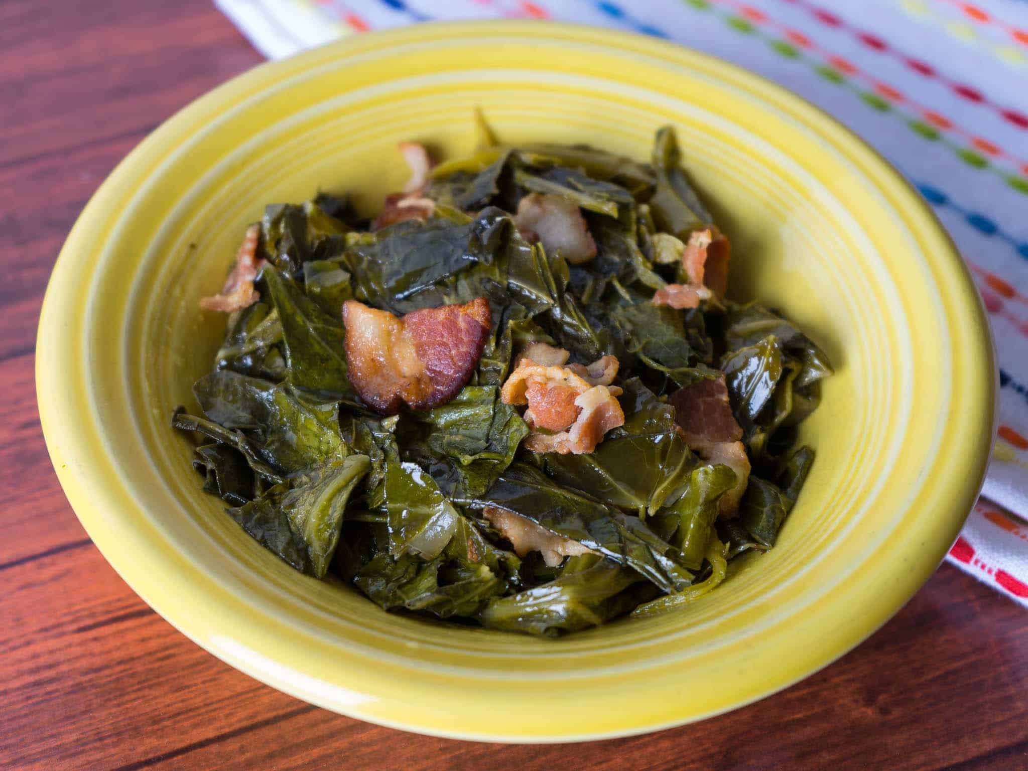 A bowl of collard greens and bacon