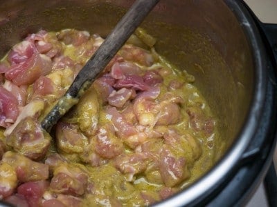 Stirring the chicken into the curry