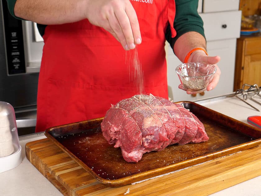 Sprinkling salt on a sirloin roast - Dry Brining FAQ | DadCooksDinner.com