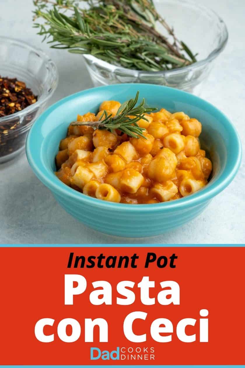 A teal bowl of pasta and chickpeas, with a sprig of rosemary on top, and a bowl of rosemary sprigs and red pepper flakes in the background.