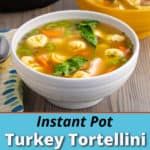 A bowl of turkey tortellini soup with carrots, spinach, tomatoes, and celery, with an instant pot visible in the background