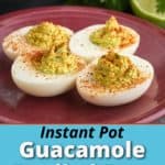 Four guacamole deviled eggs on a maroon plate, with an Instant Pot and cilantro and a lime in the background