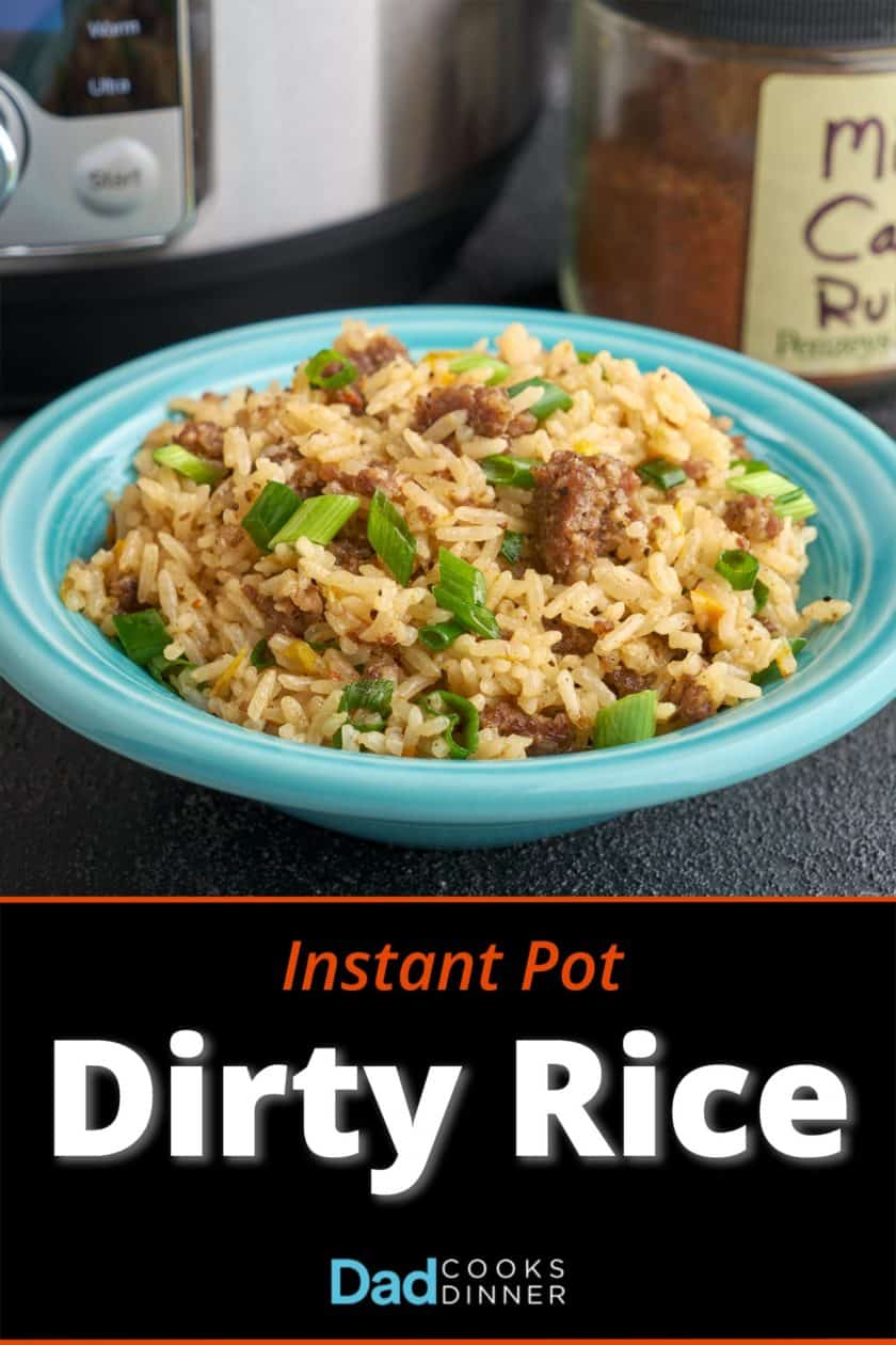 A bowl of Cajun dirty rice with an instant pot and a jar of Cajun seasoning in the background
