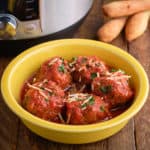 A bowl of meatballs with breadsticks and an Instant Pot