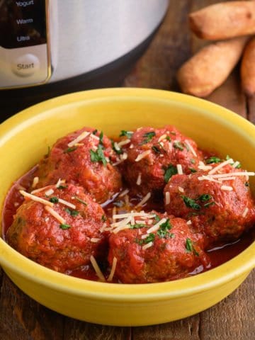 A bowl of meatballs with breadsticks and an Instant Pot