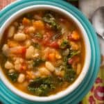 A bowl of Tuscan bean soup on a colorful plate