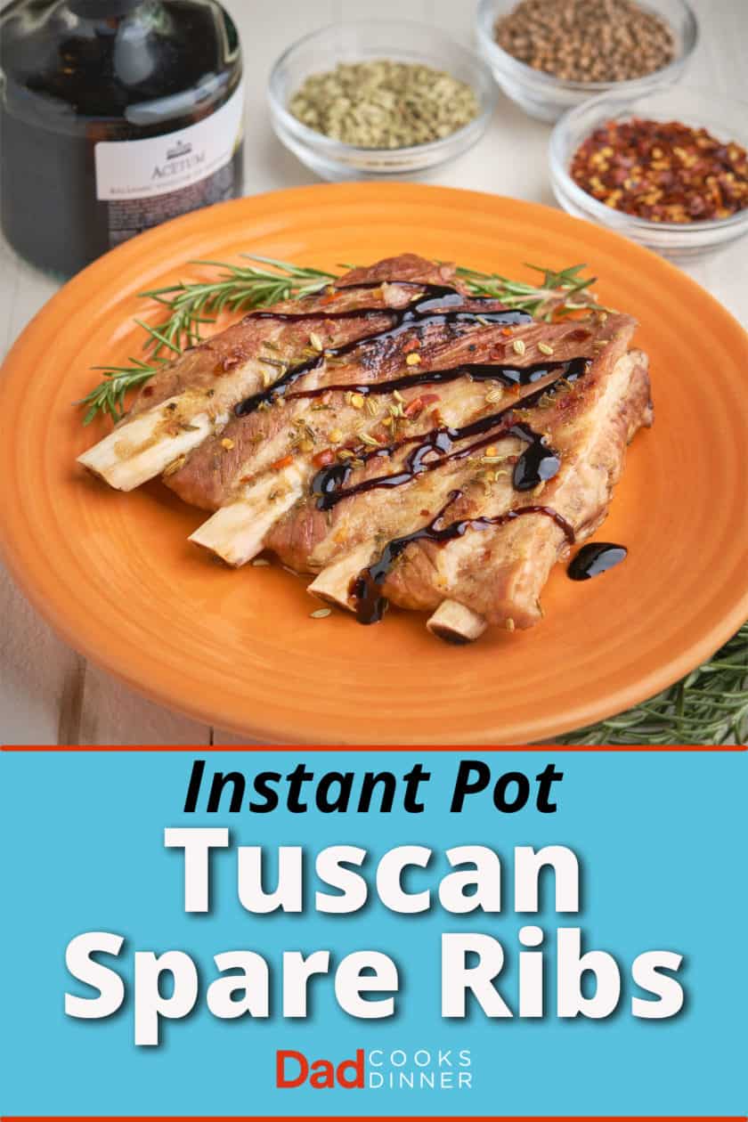A slab of 4 ribs, sprinkled with herbs and drizzled with balsamic glaze, on an orange plate, with herbs and balsamic vinegar in the background, with the text Instant Pot Tuscan Pork Ribs underneath it.