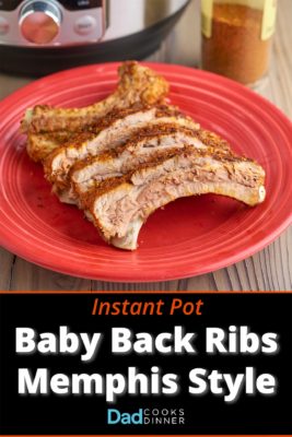 Baby back ribs with dry rub on a red plate, with an Instant Pot and a jar of dry rub in the background