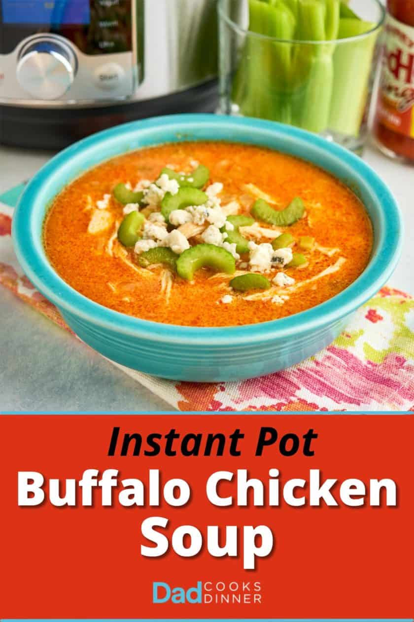 A bowl of Buffalo chicken soup topped with celery and blue cheese crumbles, with an Instant Pot and celery sticks in the background.