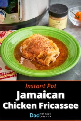A chicken thigh in Jamaican jerk chicken fricassee sauce, on a green plate, in front of an Instant Pot, a jar of Jerk seasoning, and a Scotch Bonnet pepper