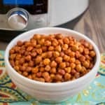 A bowl of desi chickpeas (Desi Chana) with an Instant Pot in the background