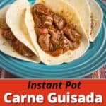 A plate of three carne guisada tacos