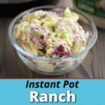 A bowl of ranch potato salad with an Instant Pot and bottle of dressing in the background