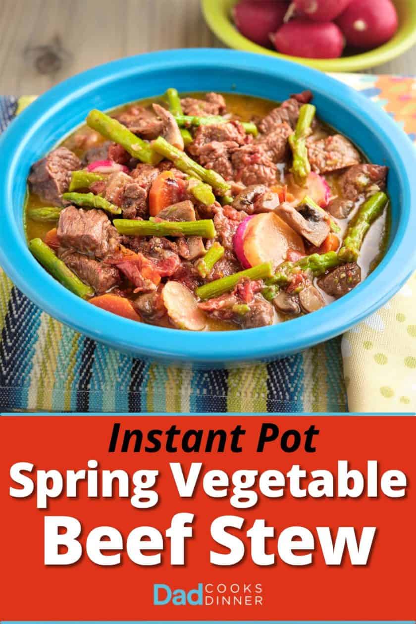 A bowl of beef stew with asparagus, carrots, and radishes.