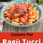 A bowl of pasta, sauced with ragu Tucci, topped with a big beef short rib, with an Instant Pot, a glass of wine, and a bowl of red pepper flakes in the background.