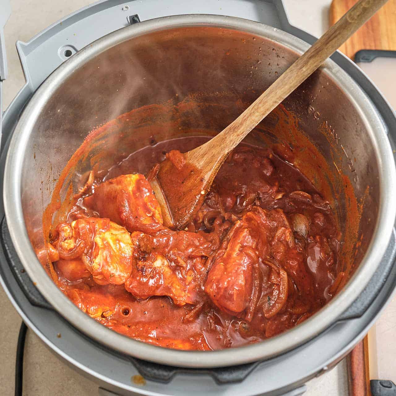 Chicken stirred into paprikash in an Instant Pot