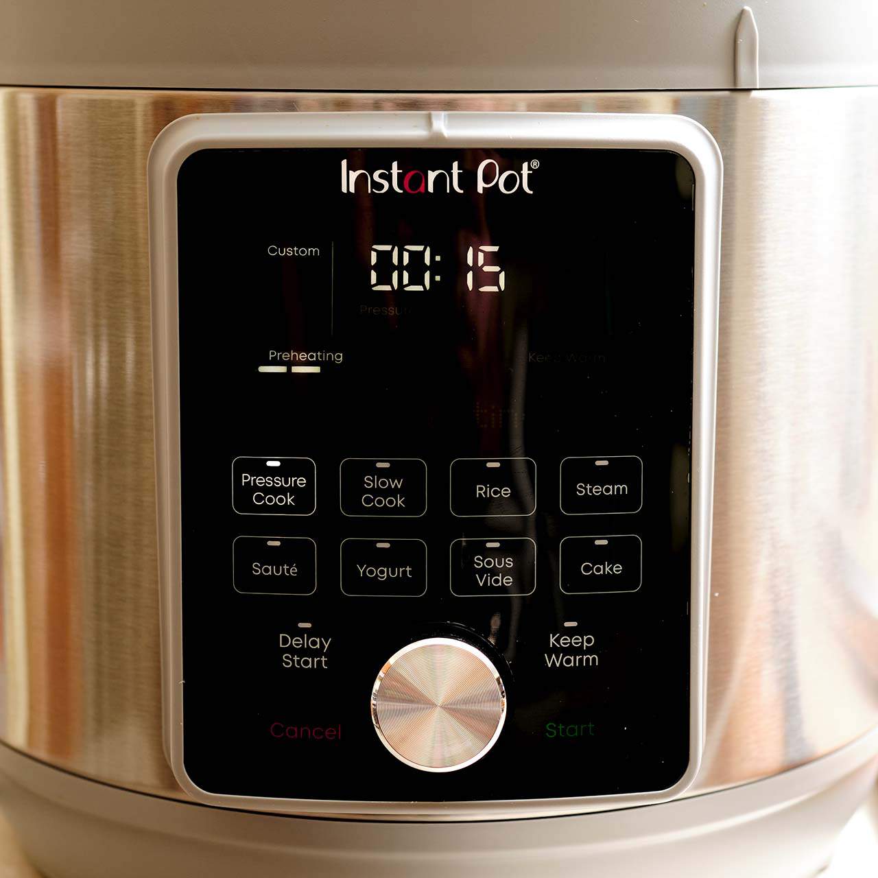 An instant pot set to pressure cook for 15 minutes