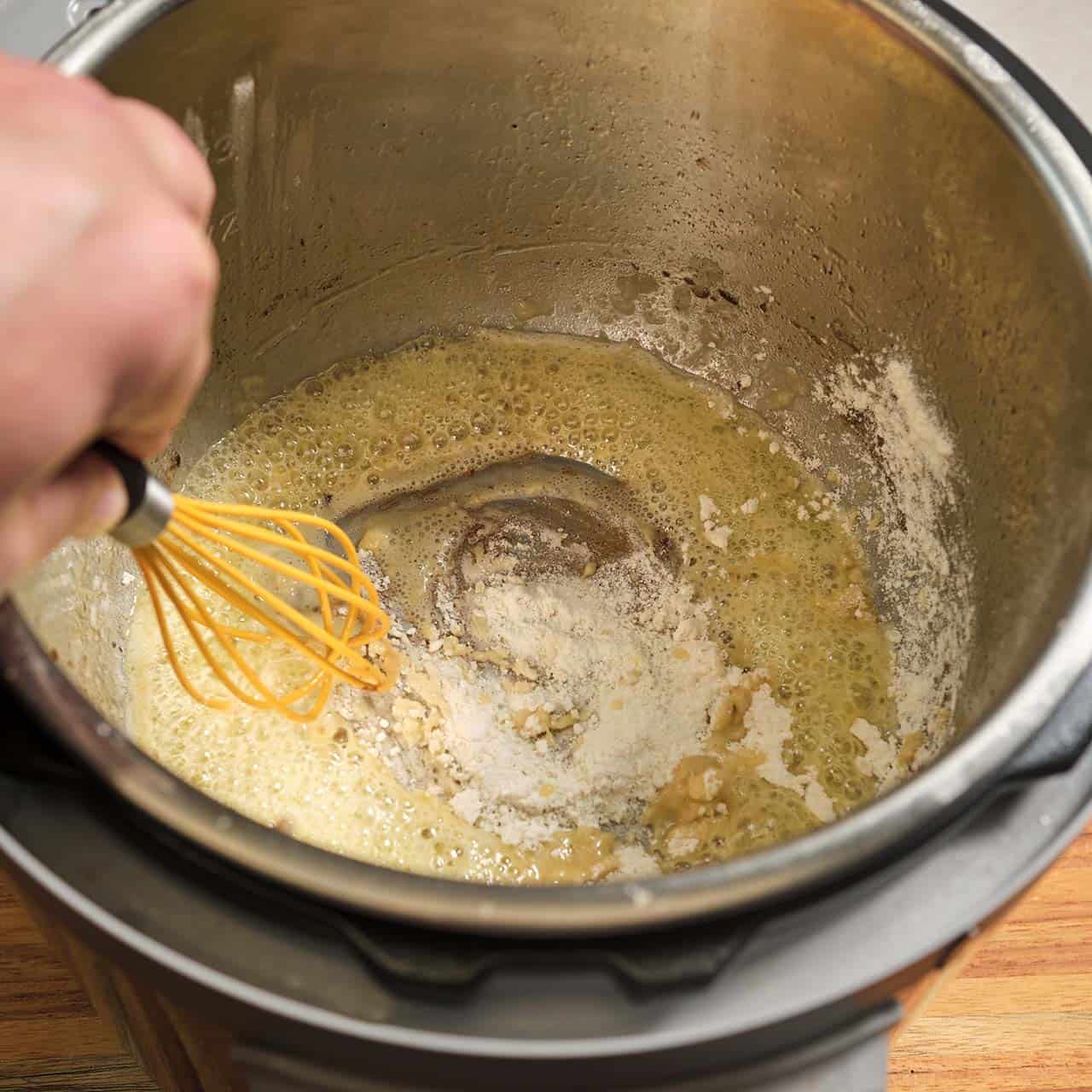 Whisking flour into melted butter in an Instant Pot
