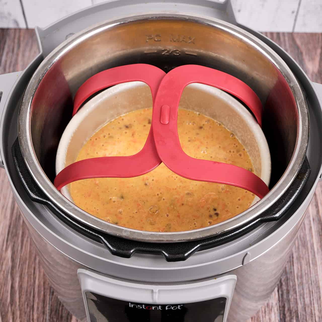 A pan of carrot cake batter on a baking sling in an Instant Pot