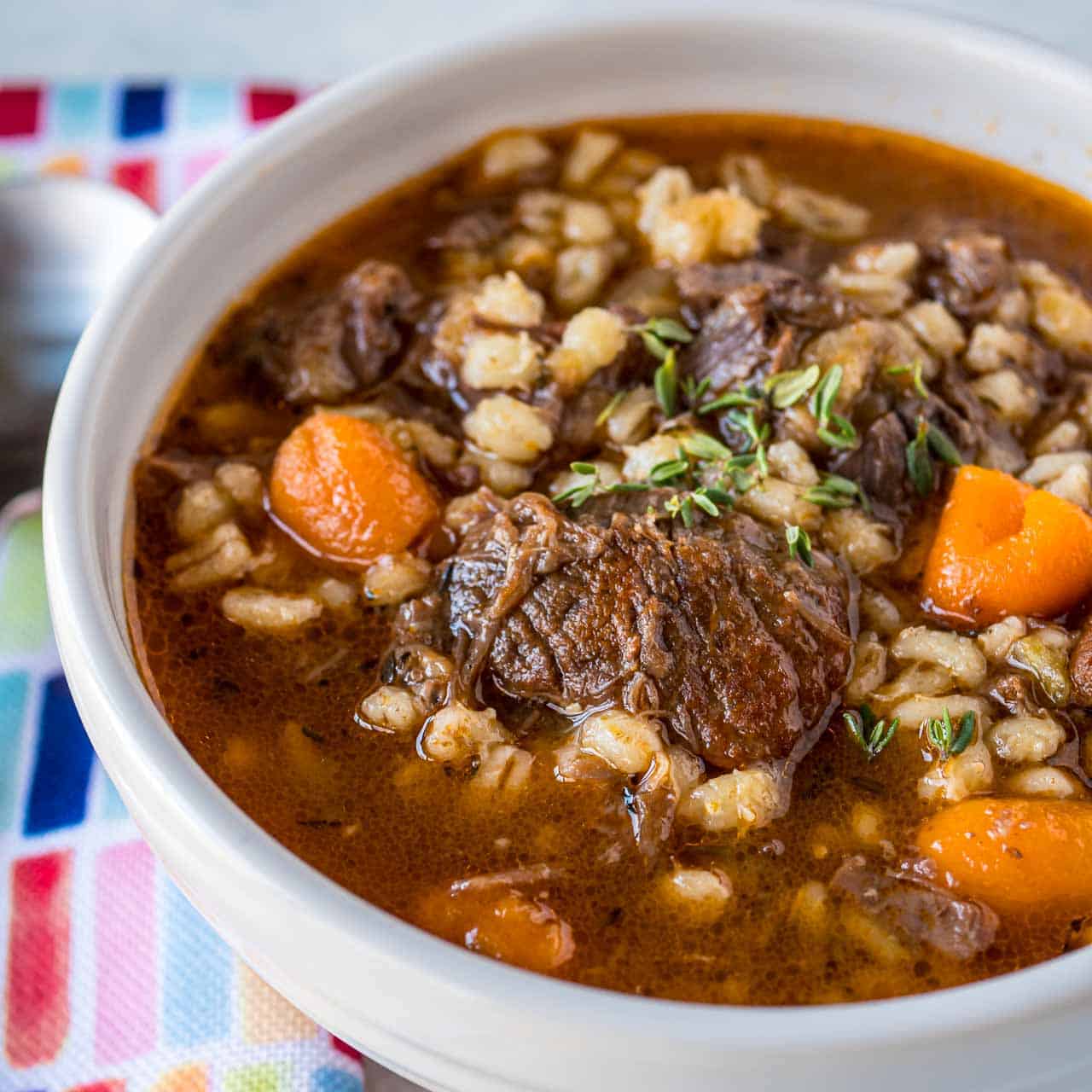 A bowl of beef and barley soup