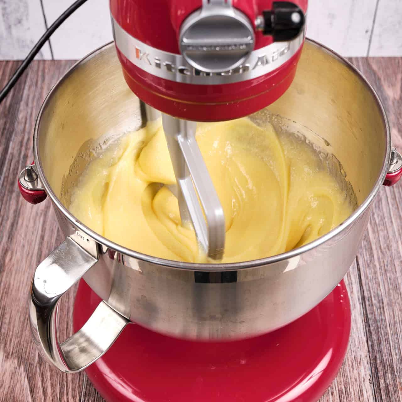 A stand mixer beating batter