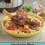 A lamb shank on a bowl of couscous with an Instant Pot in the background