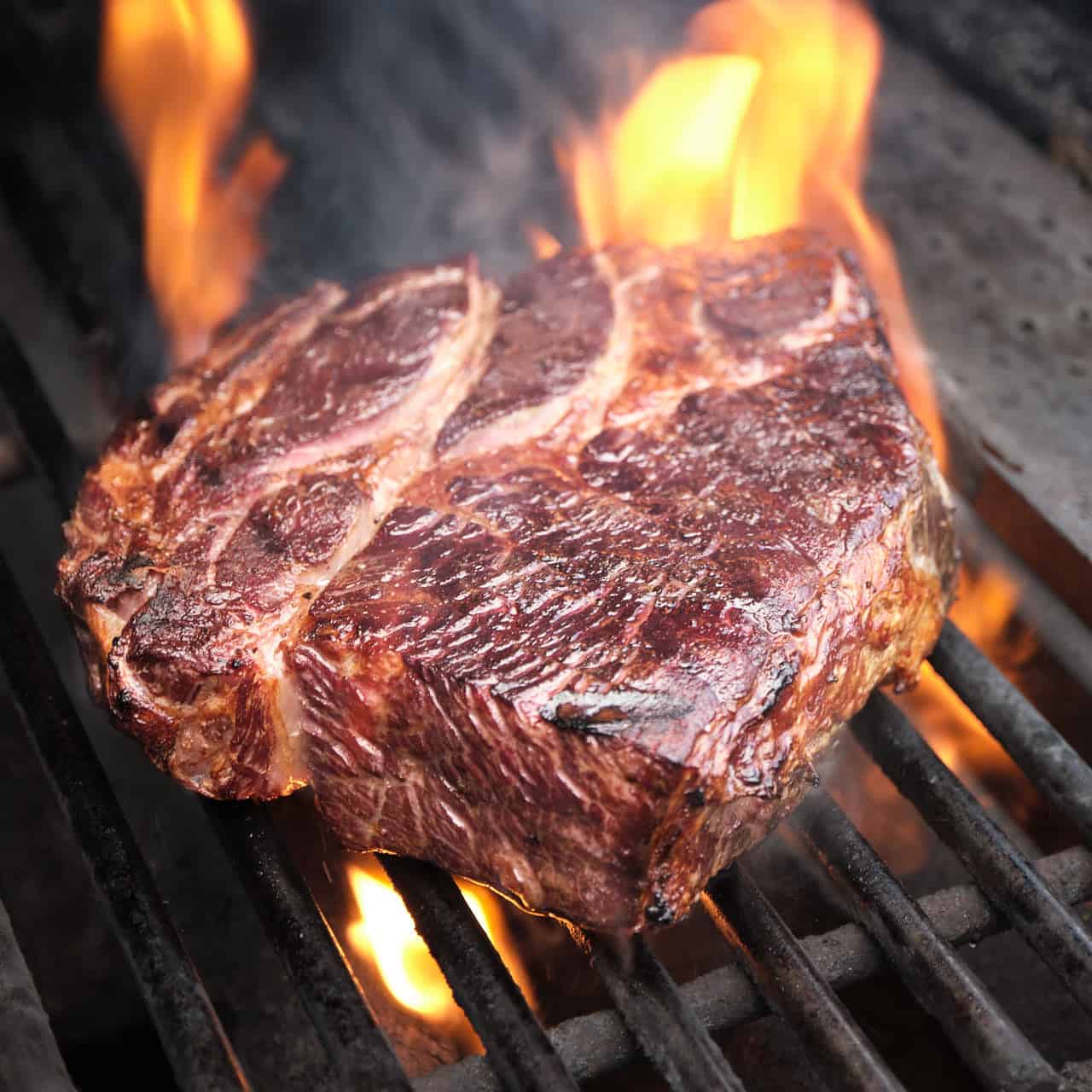 Chuck steak searing on the grill