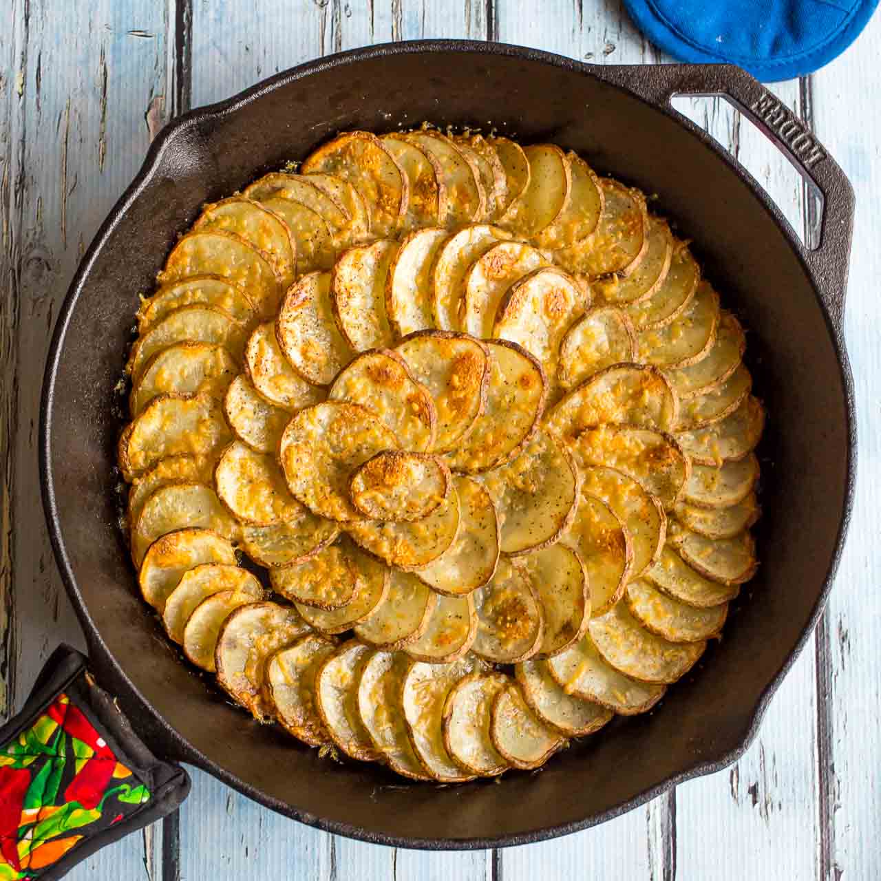 Cast iron skillet with a spiral of potatoes