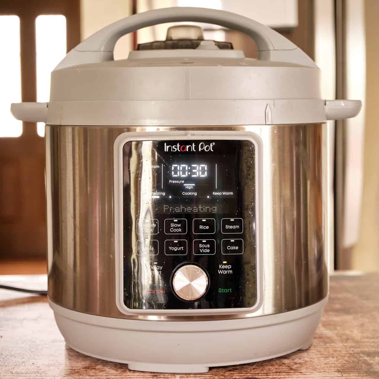 An Instant Pot set to pressure cook for 30 minutes at high pressure