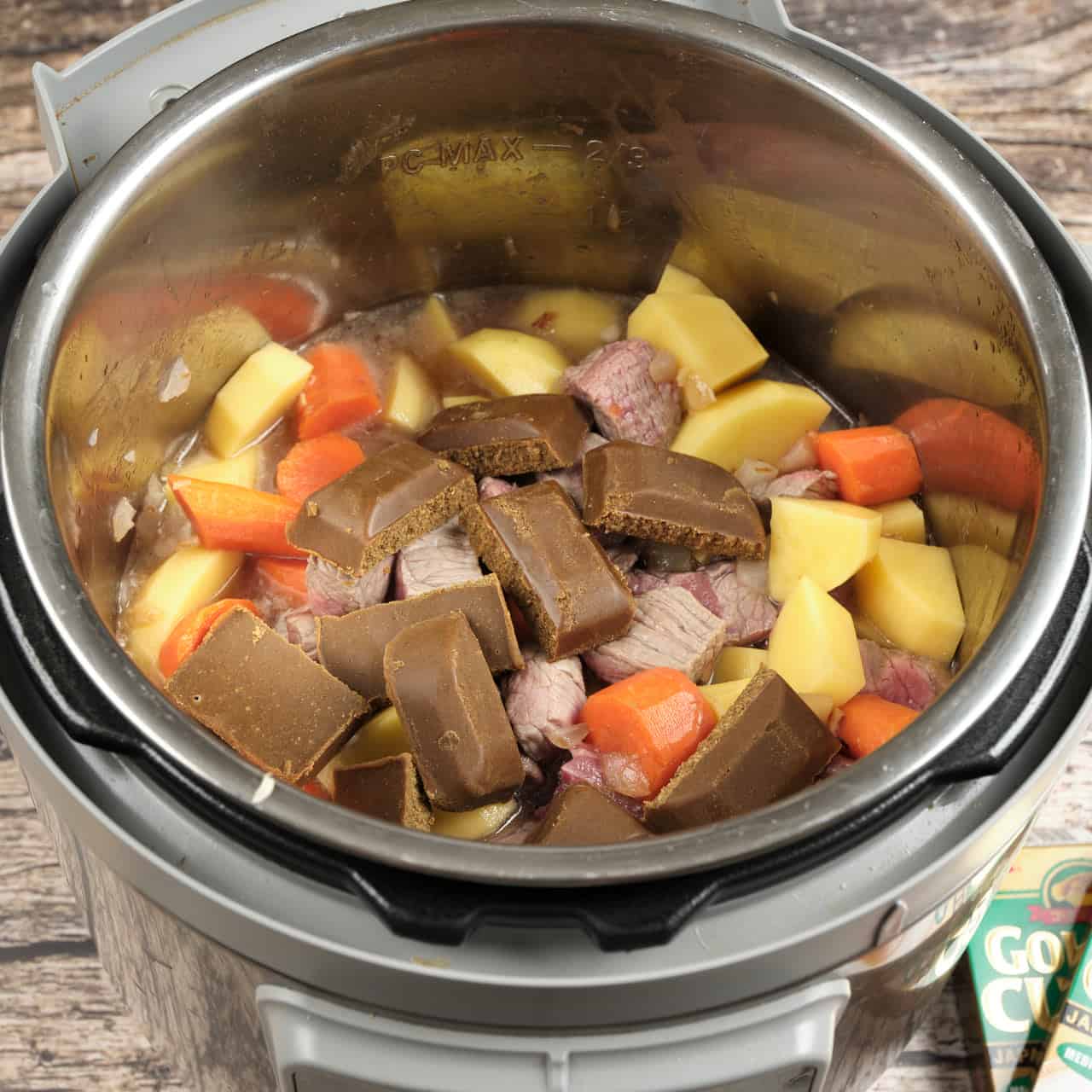 All the Japanese Curry ingredients in an Instant Pot with the Curry Mix cubes on top