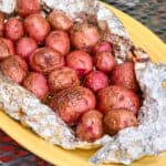 A platter of grilled baby potatoes in foil