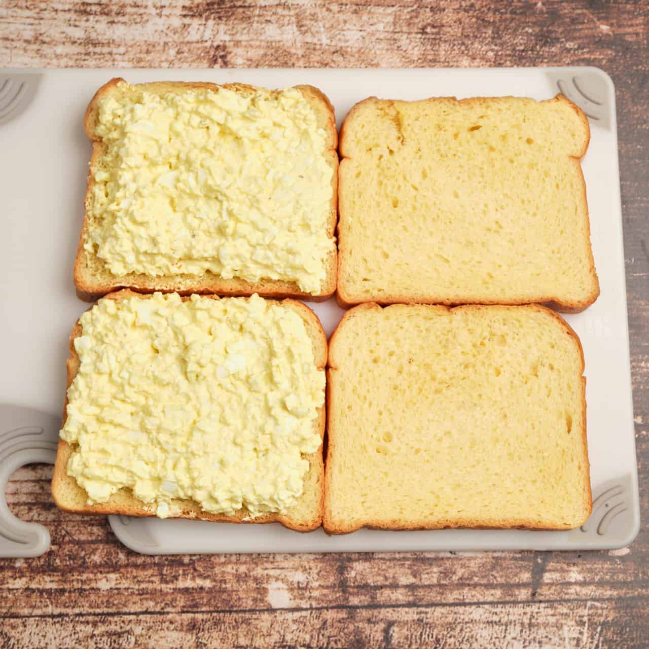 Making Japanese Egg Salad Sandwiches on a cutting board