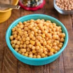 A bowl of Instant Pot Small Chickpeas (Ceci Piccoli) on a wood table