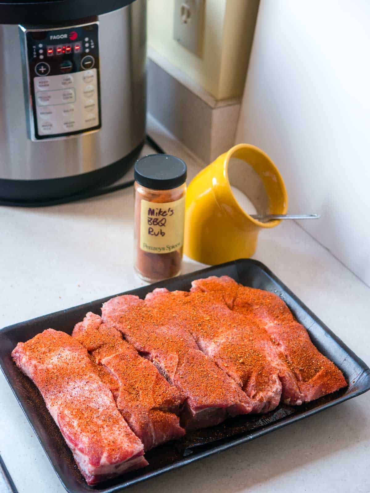 Boneless pork ribs sprinkled with BBQ rub and ready for the pressure cooker